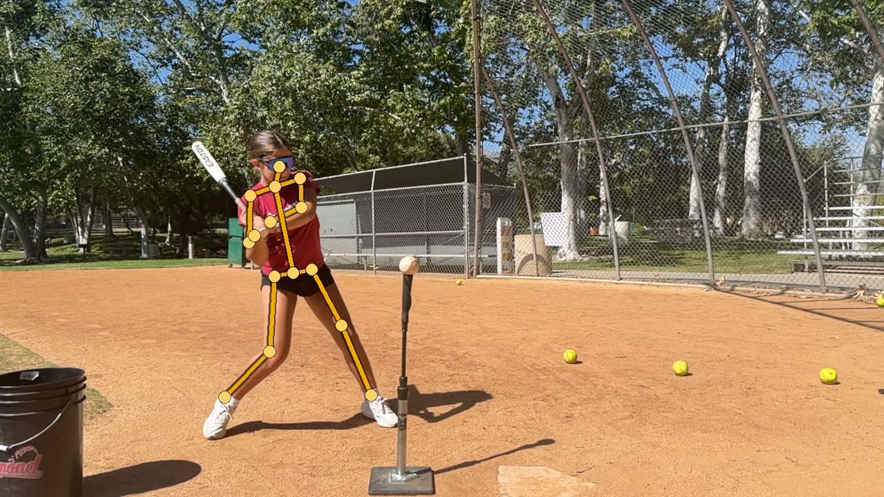 A young hitter taking a cut off a tee, filmed side-on, with SwingDino's body-pose skeleton drawn on the real frame: head, shoulders, elbows, hips, knees, and ankles tracked through the swing.